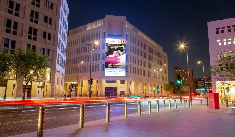 Digital display on a building façade in Msheireb Downtown Doha at night